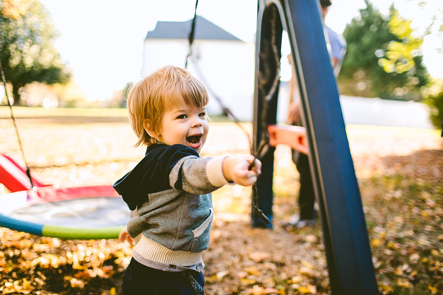 Kid holding a stick during Raleigh family photographs