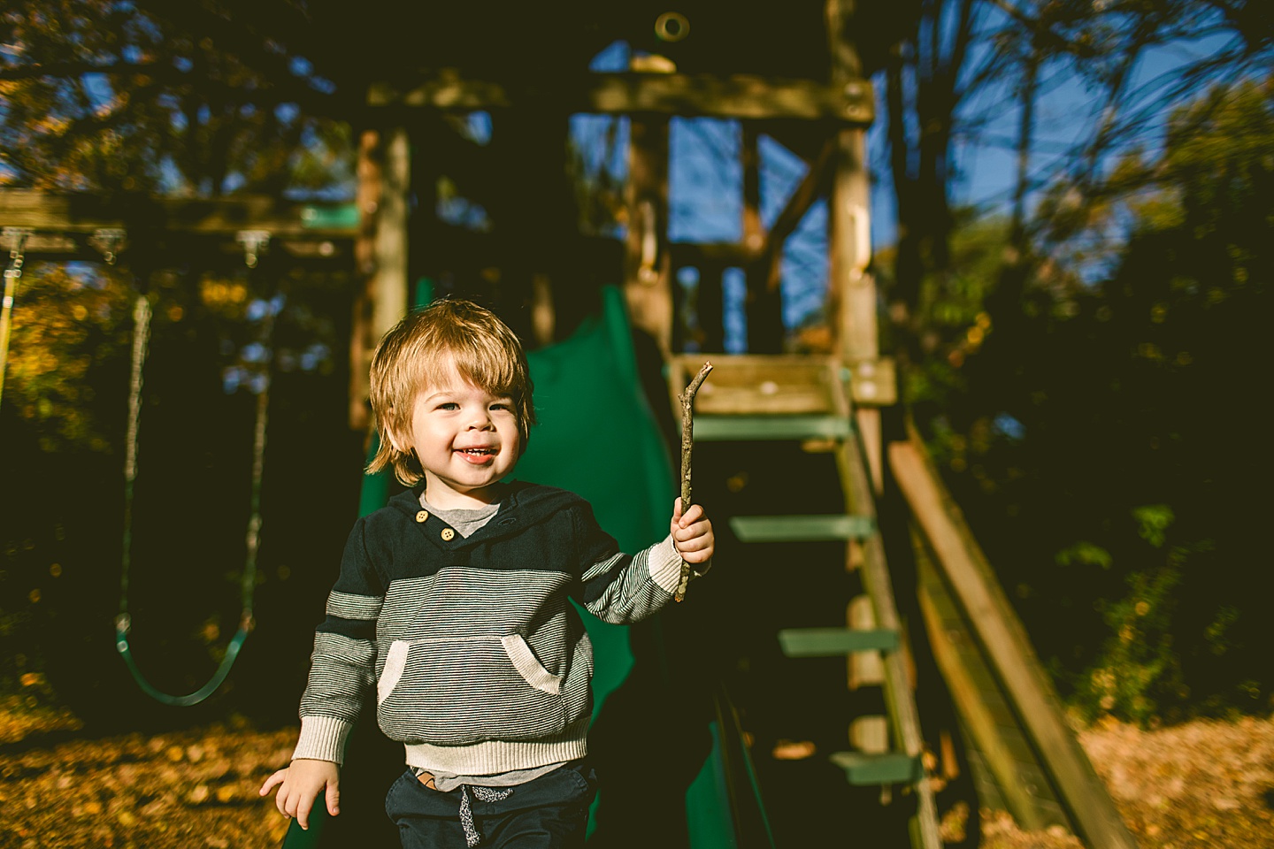 Toddler holding stick