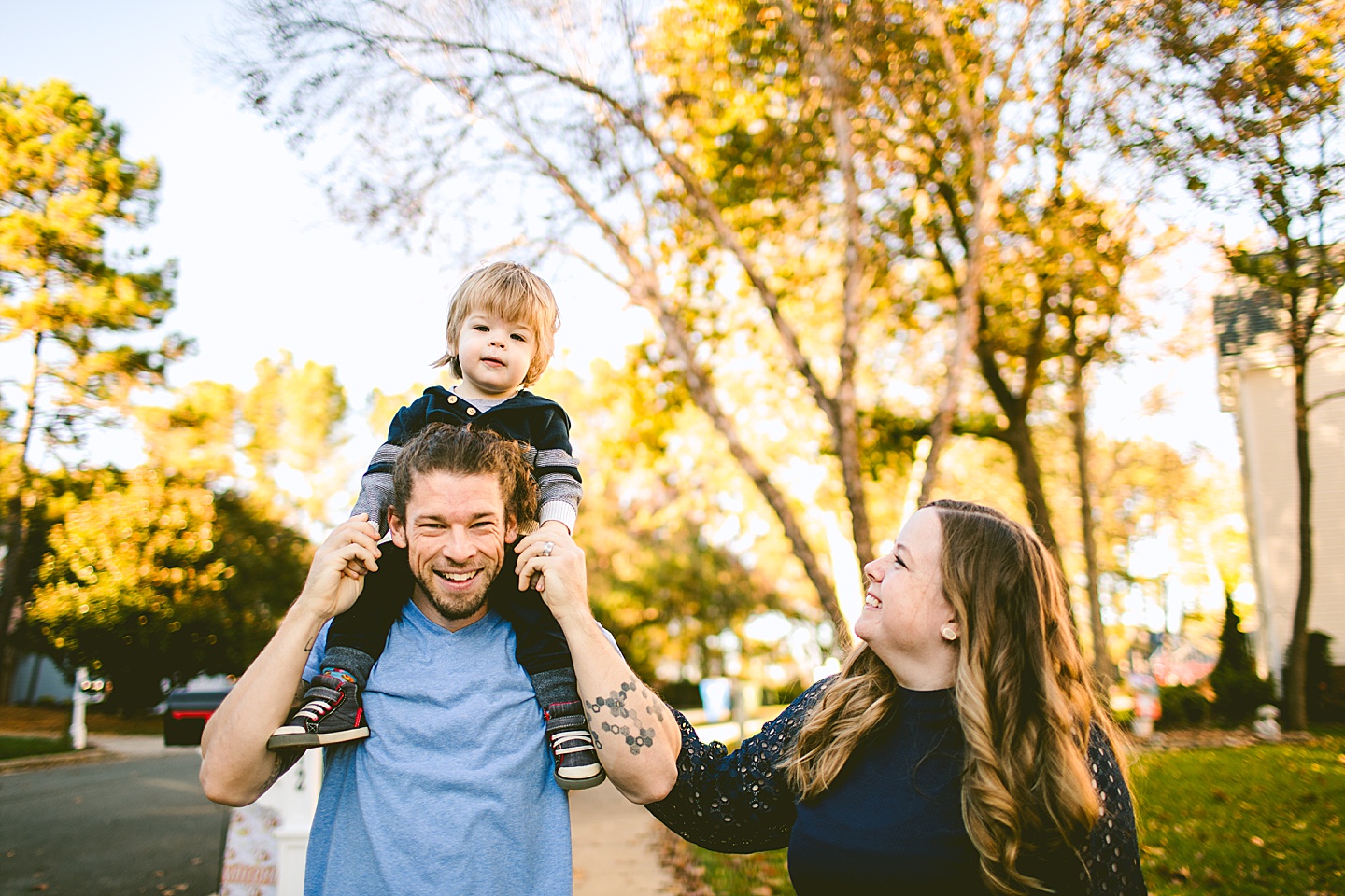 Kid sitting on Dad's shoulders