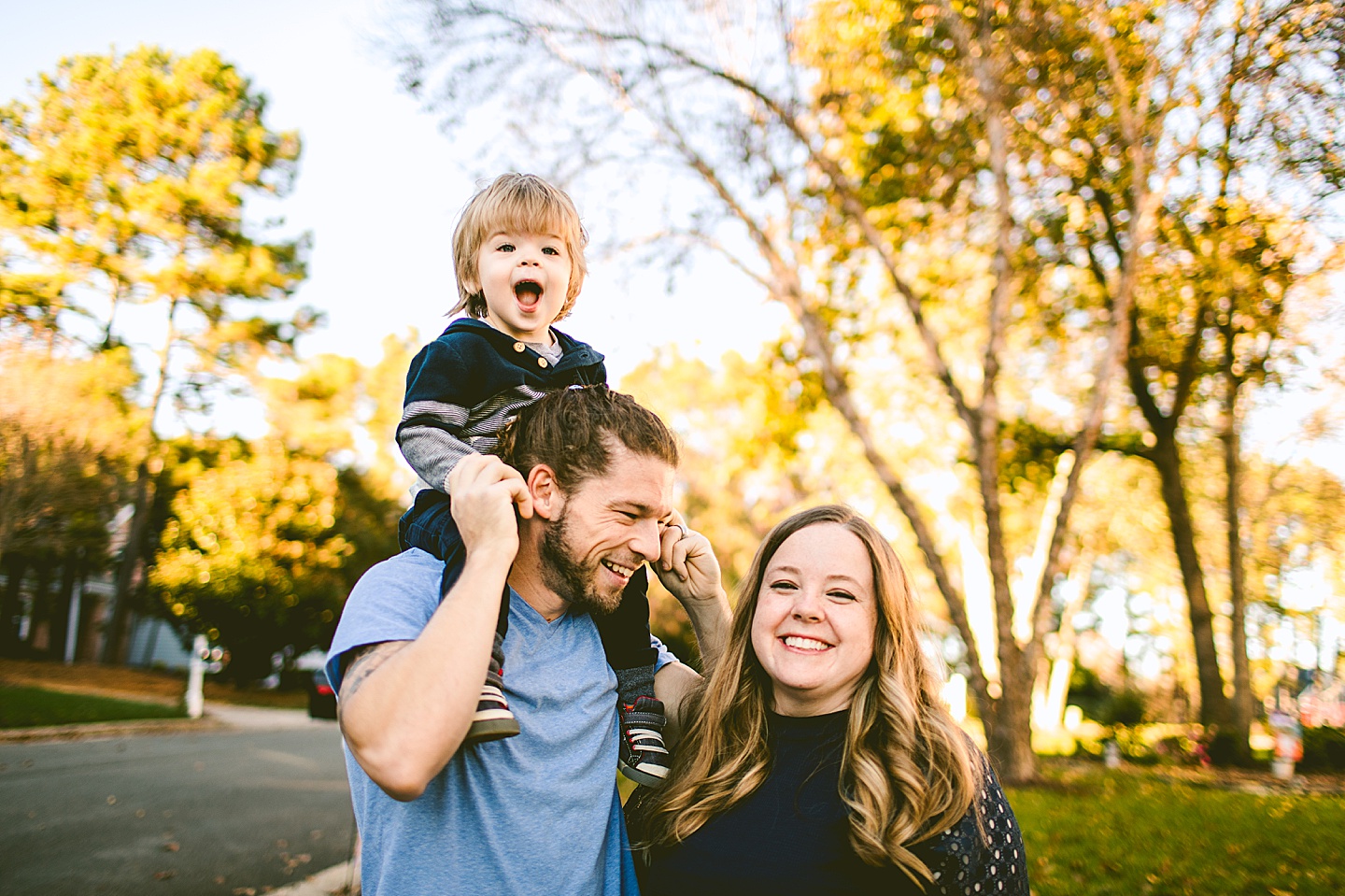 Kid sitting on Dad's shoulders