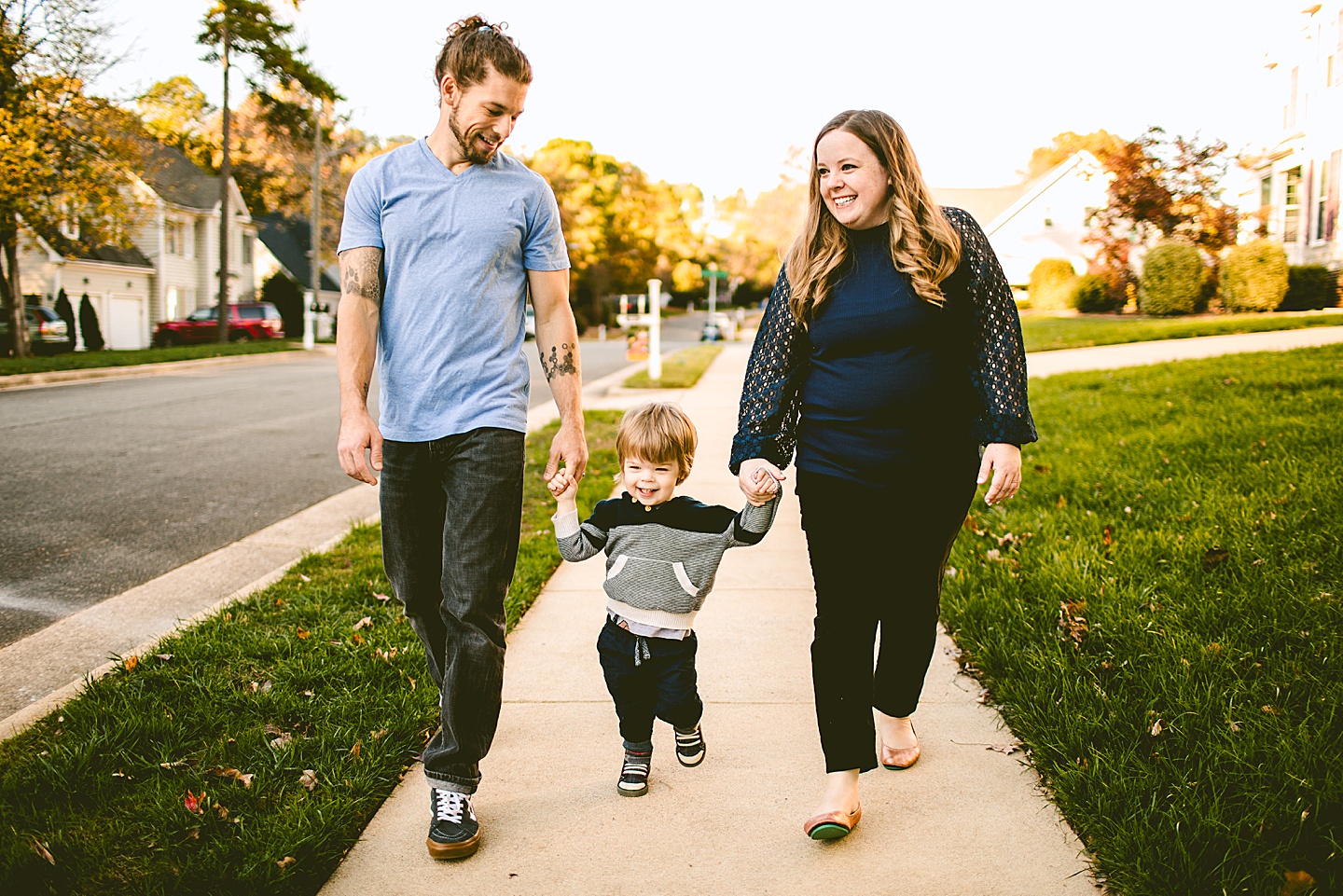 Toddler going on walk with parents