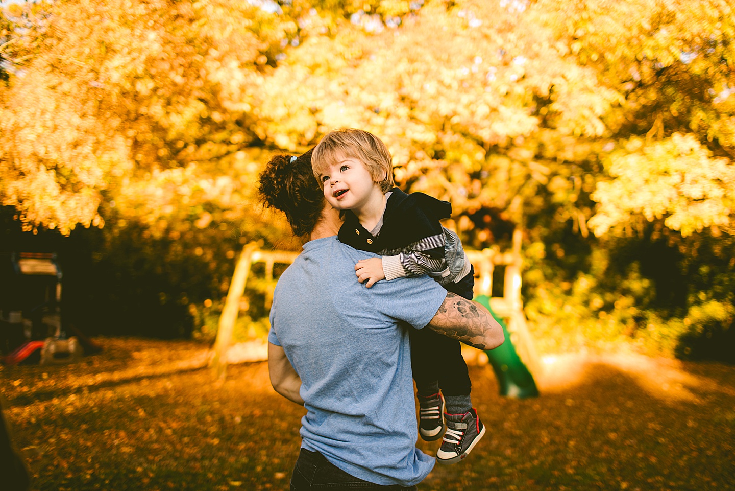 Dad carrying toddler