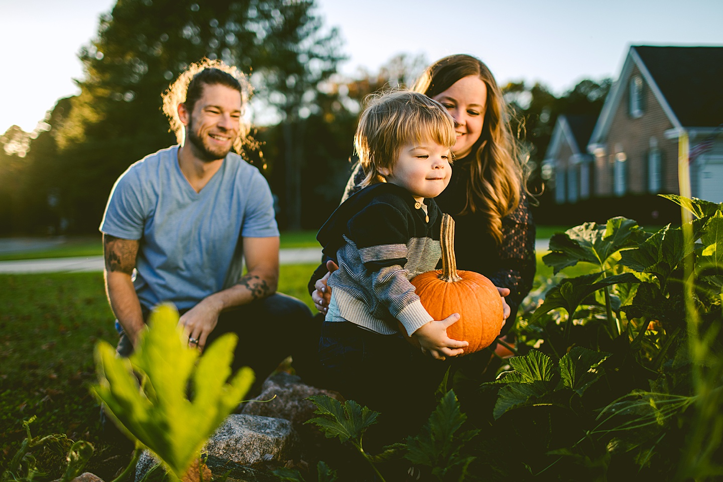 Kid carrying pumpkin at family photos