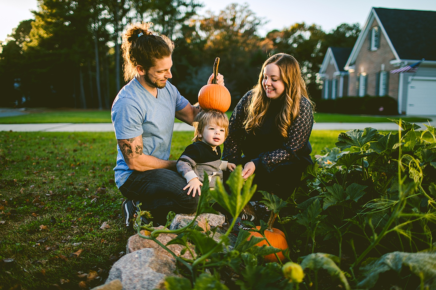 Kid carrying pumpkin at family photos