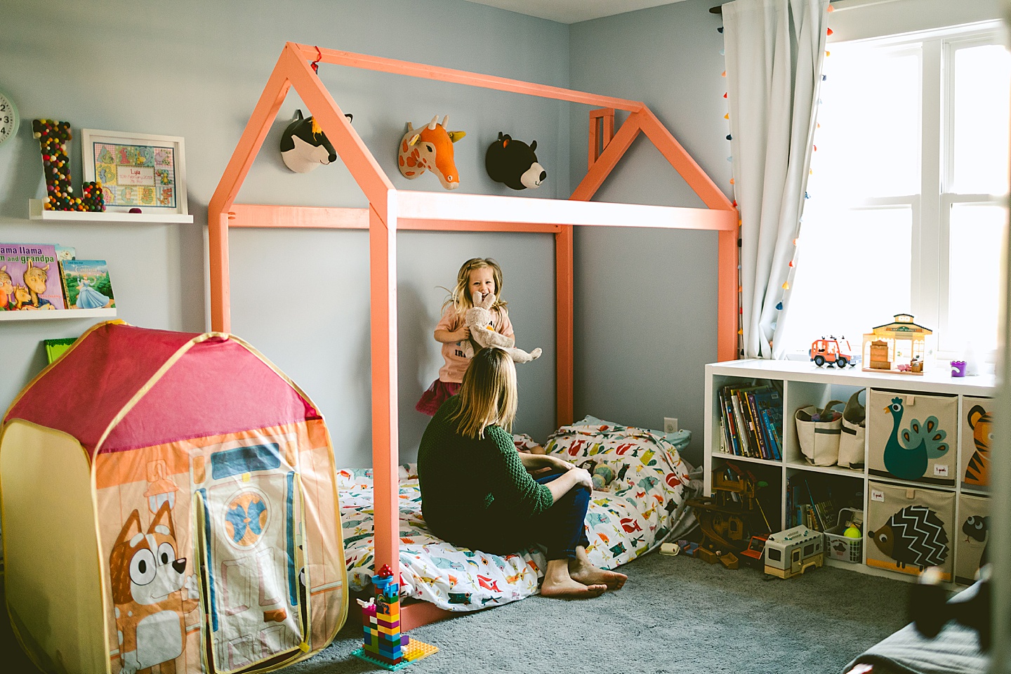 Girl jumping on bed