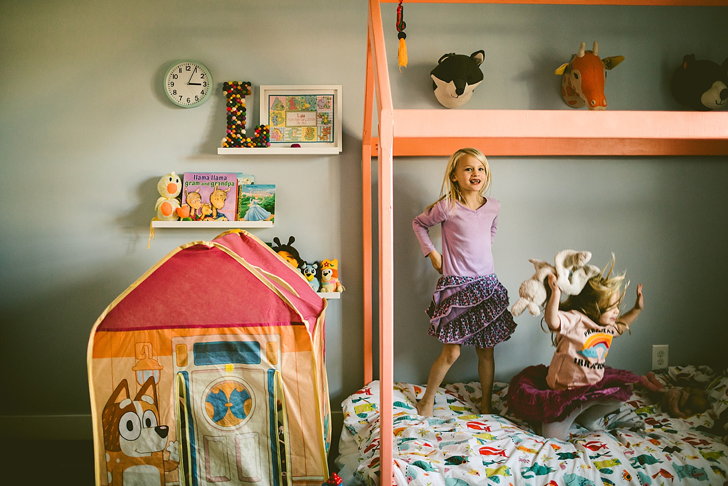 Sisters jumping on the bed