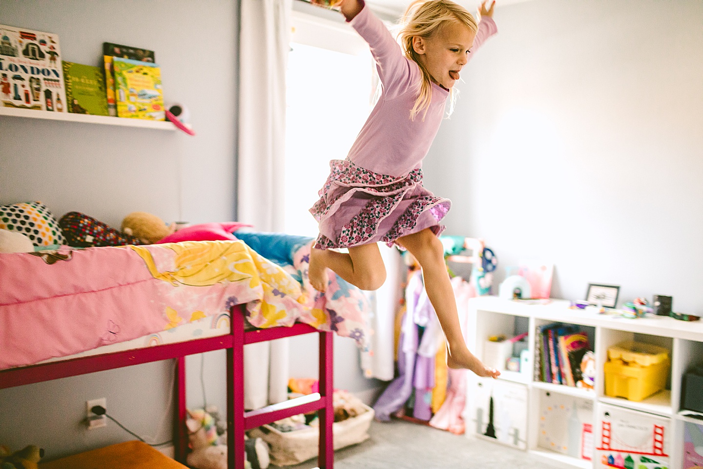 Girl jumping off her bunk bed