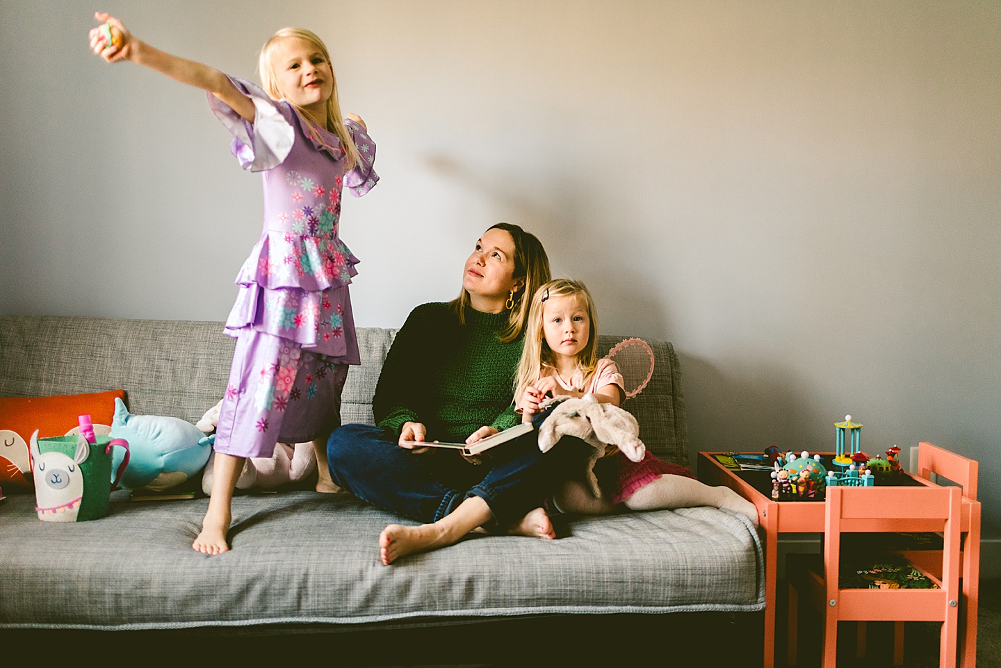 Mom reads a book to her daughter