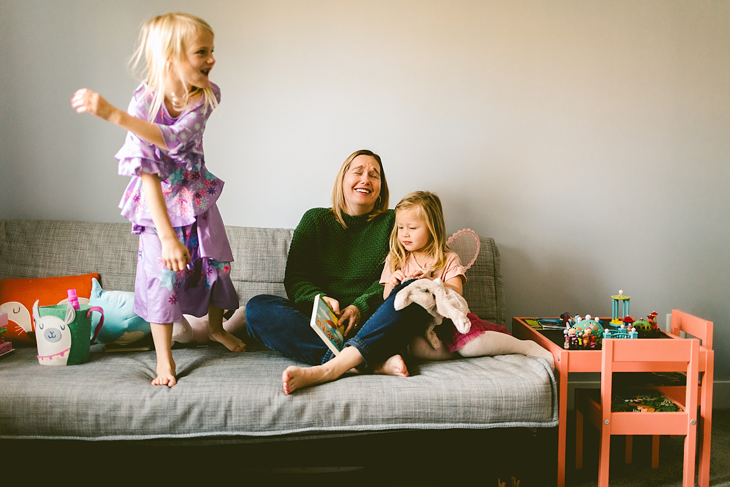 Mom reads a book to her daughter