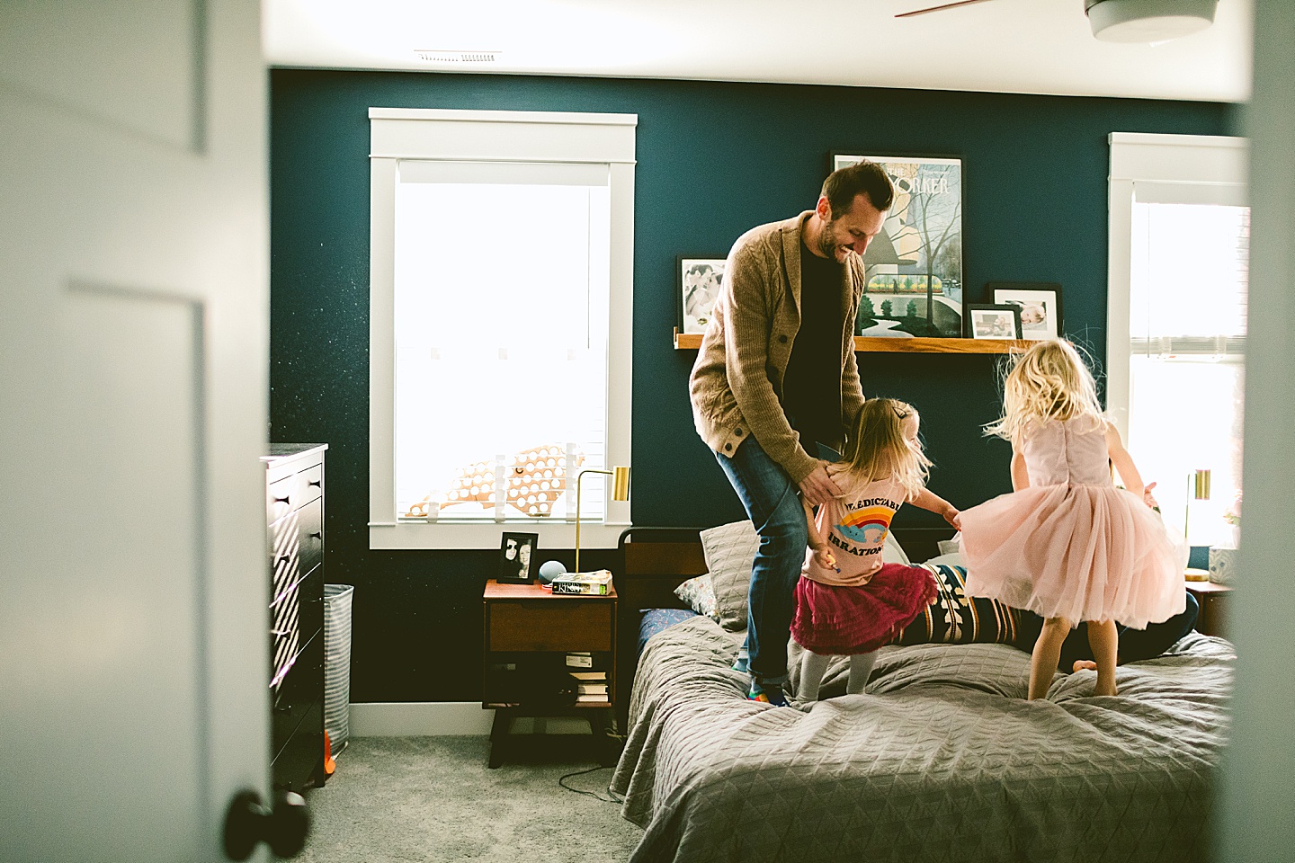 Little kids jumping on the bed