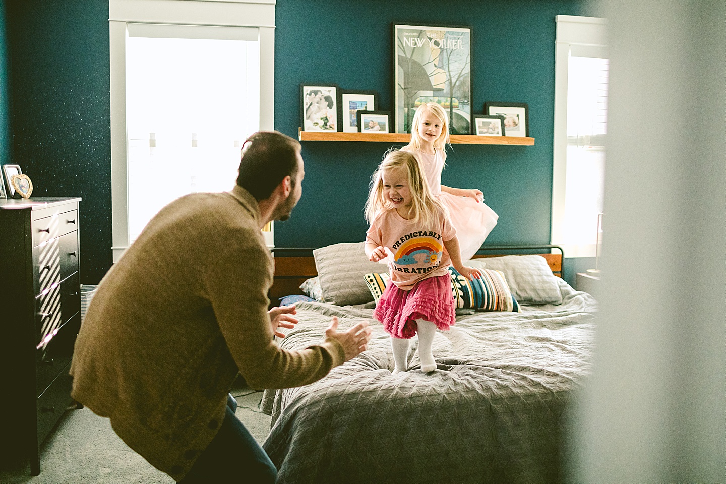 Little kids jumping on the bed