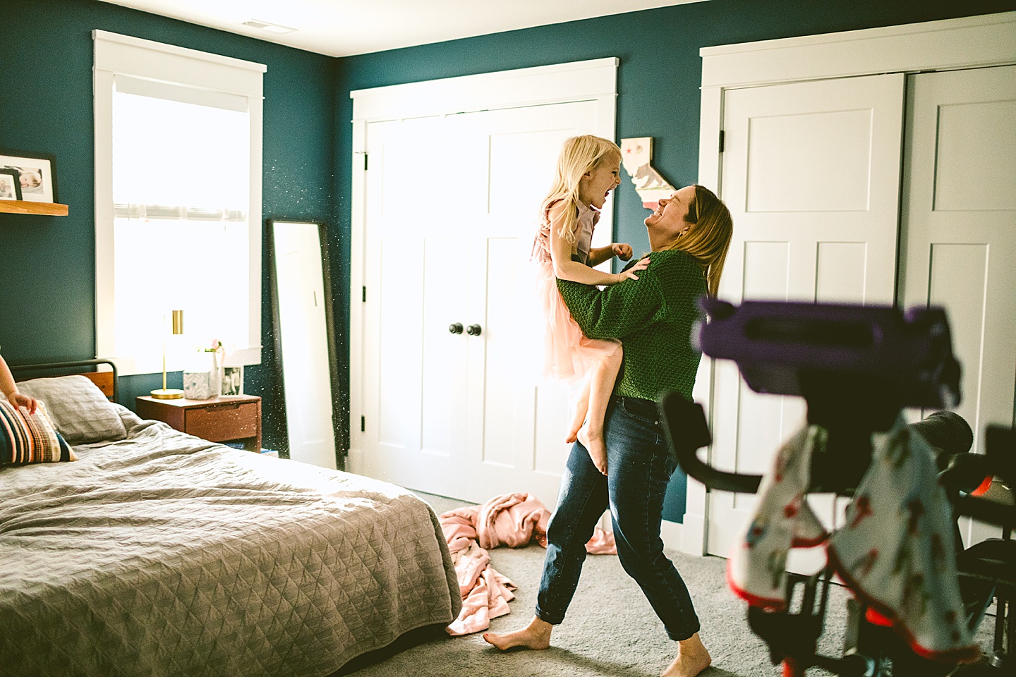 Mom holding daughter