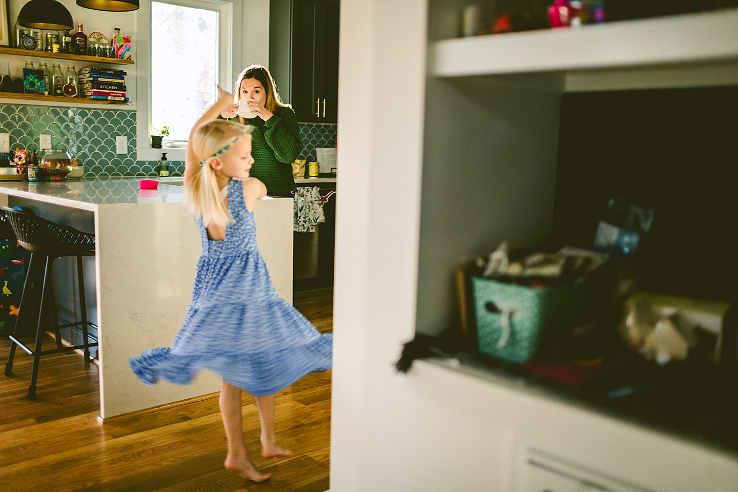 Girl twirling in the kitchen