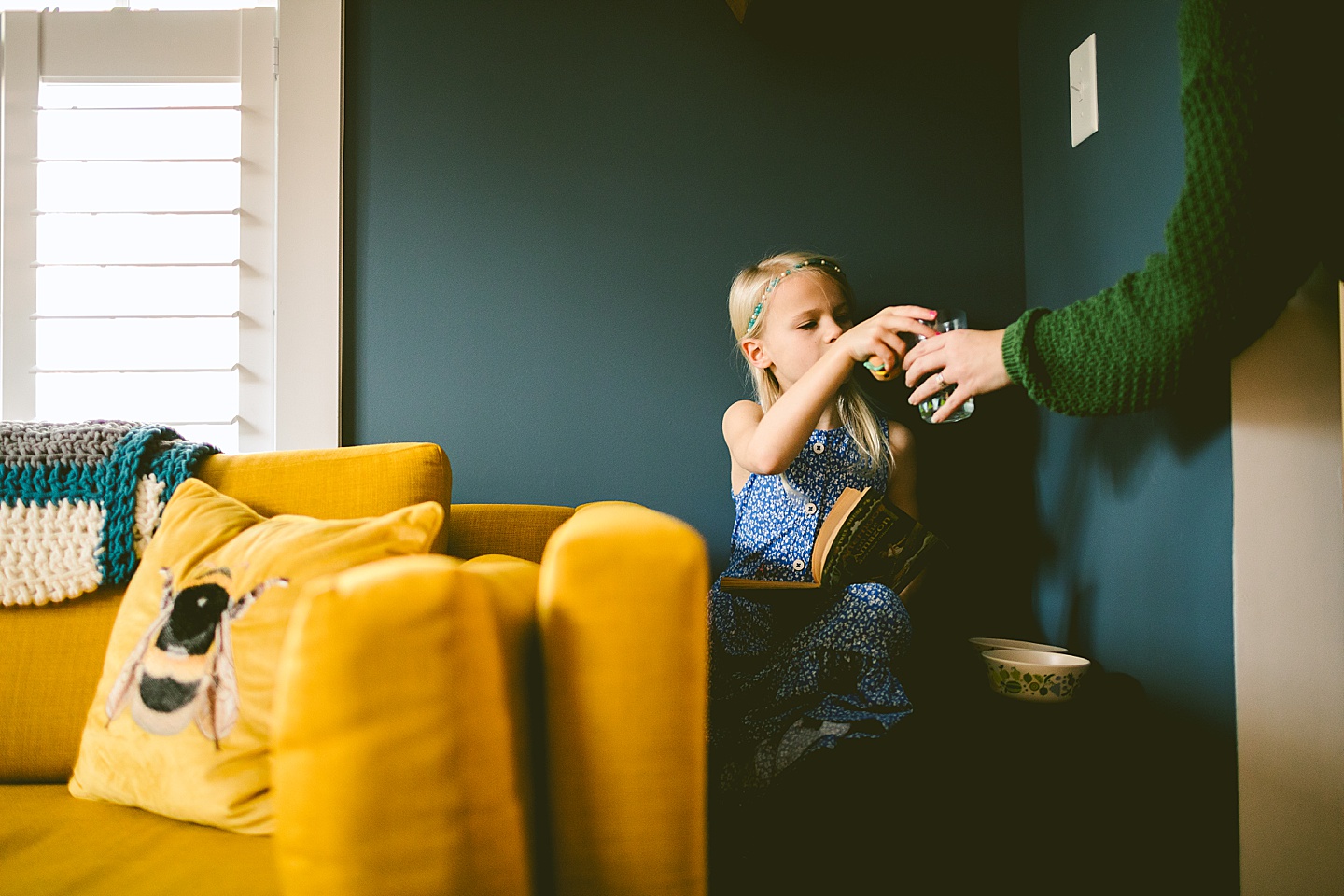 Mom getting a glass of water for daughter