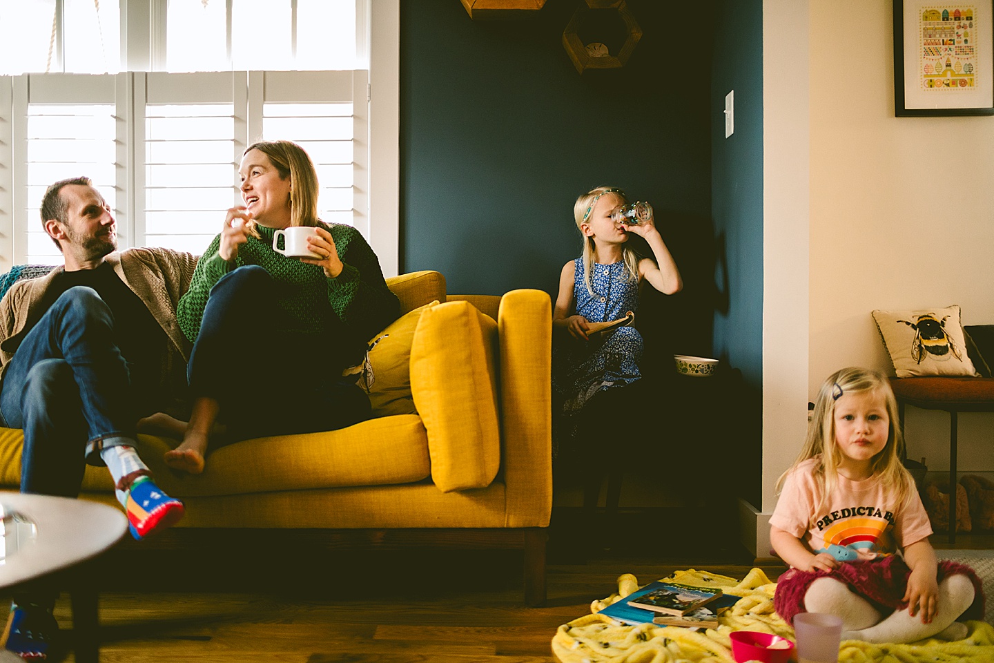 Family sitting around living room