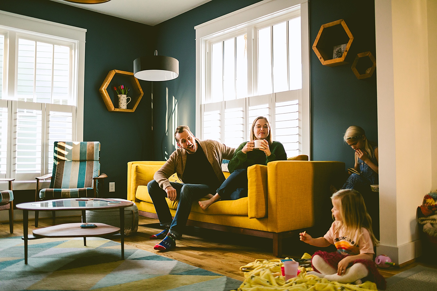 Family sitting around living room