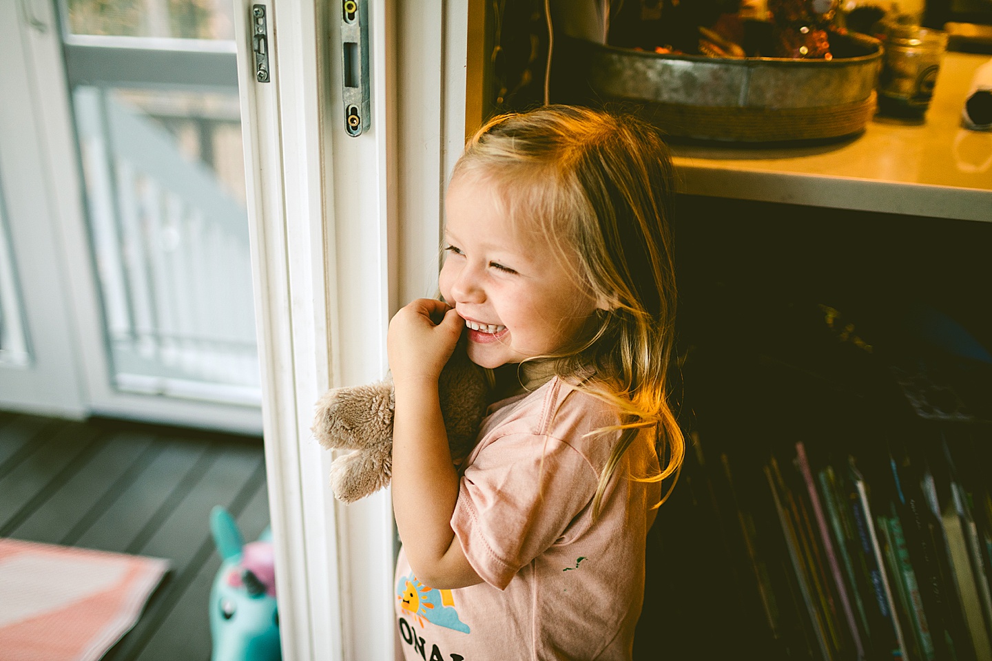 Little girl smiling outside at family