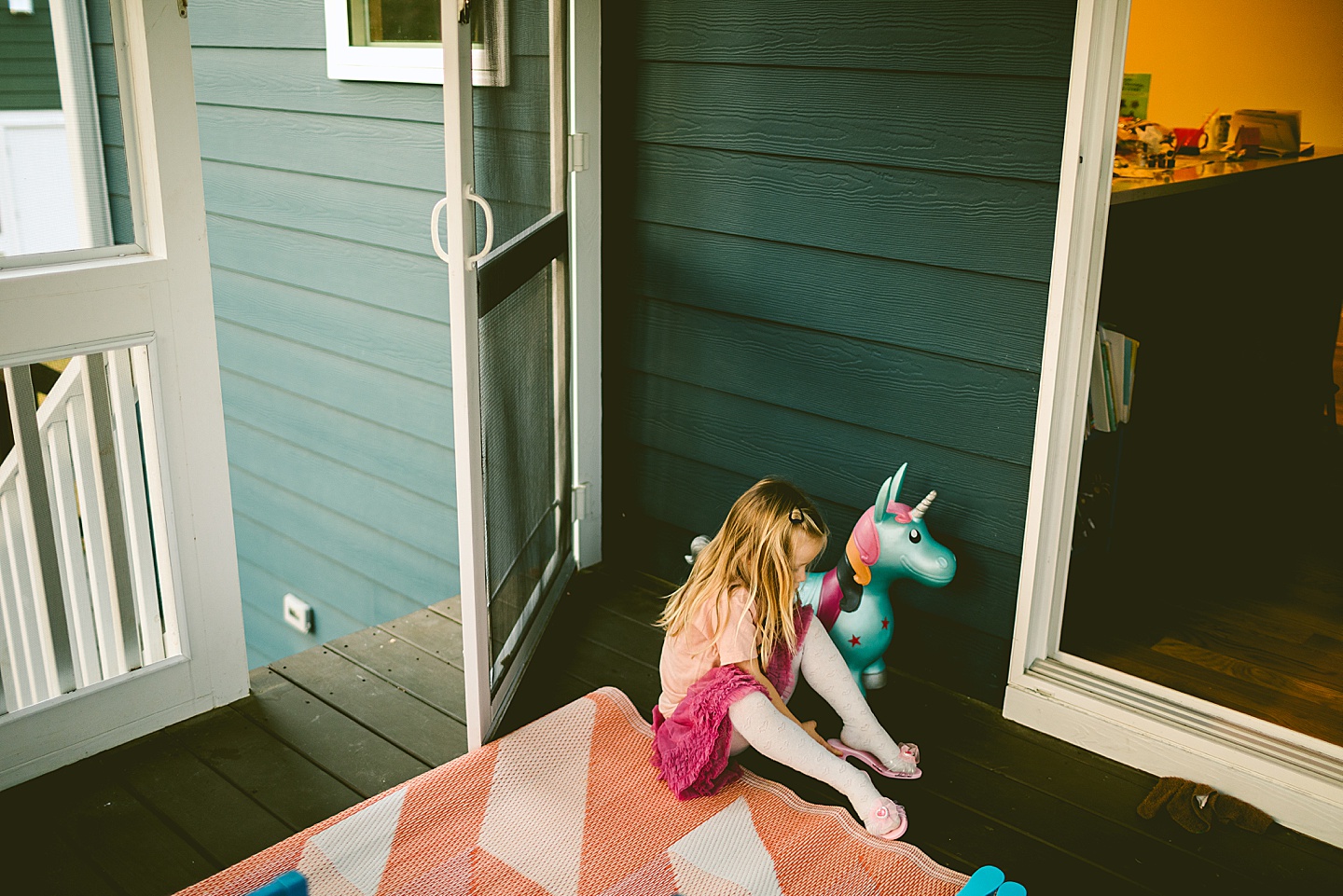 Girl putting on play shoes