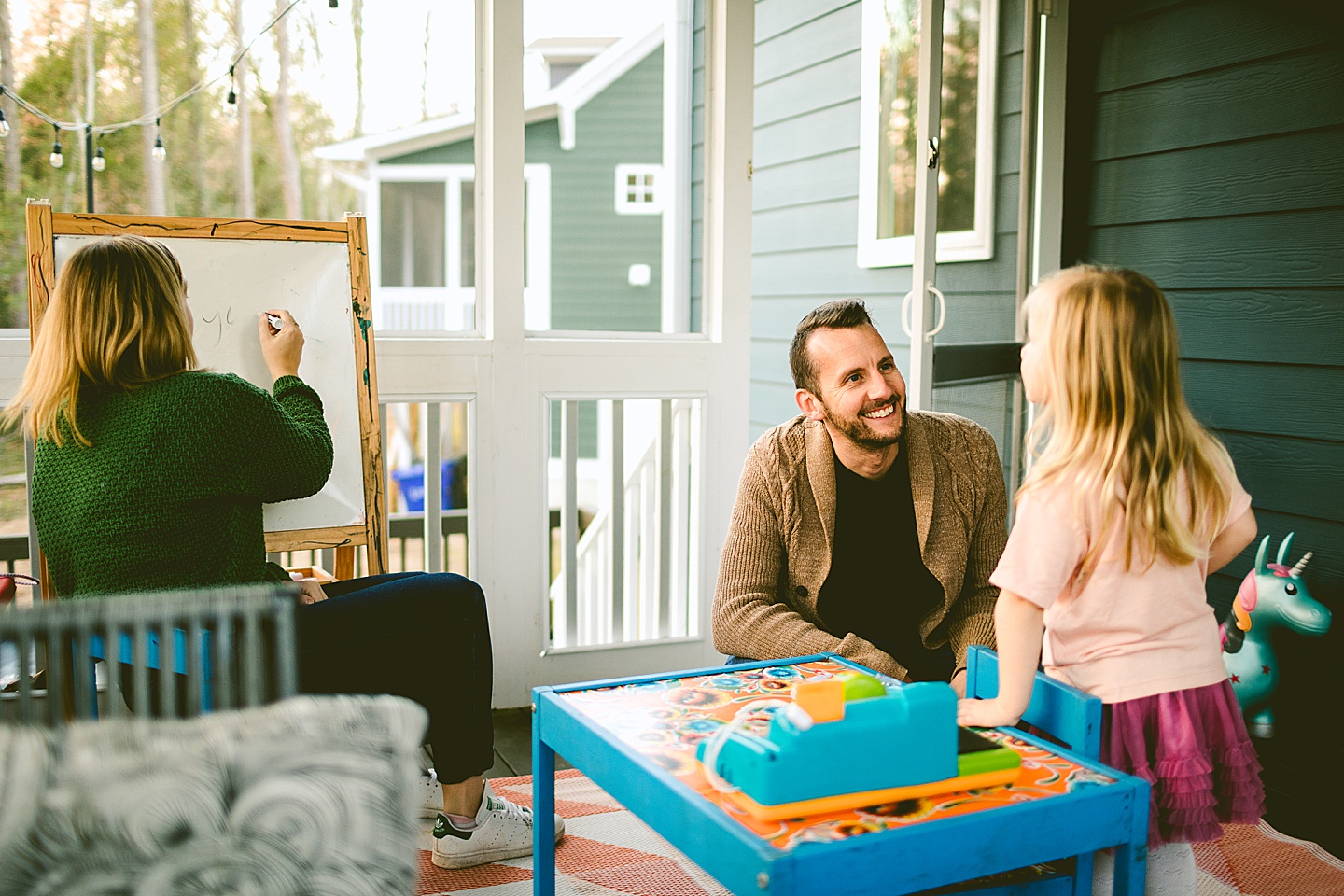 Family playing school outside