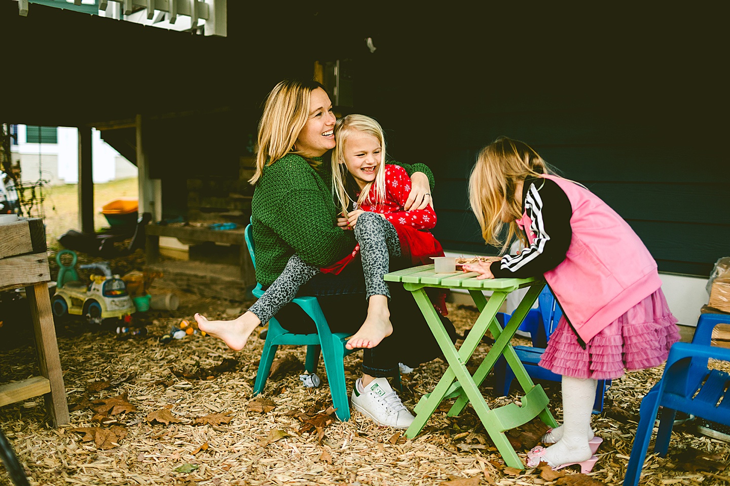 Mom sitting with daughters