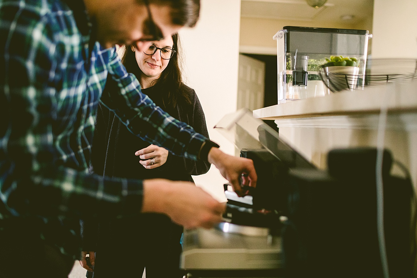 Couple putting a record on a record player