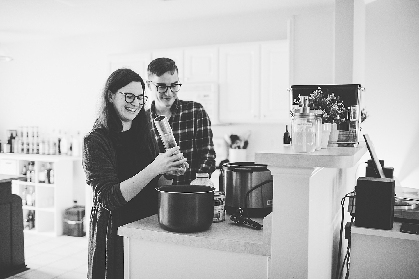 Couple making dinner together in kitchen at their home