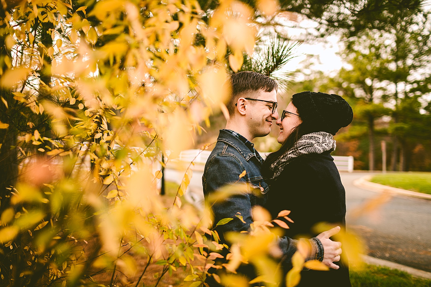 Couple posing for photographs outside in Raleigh