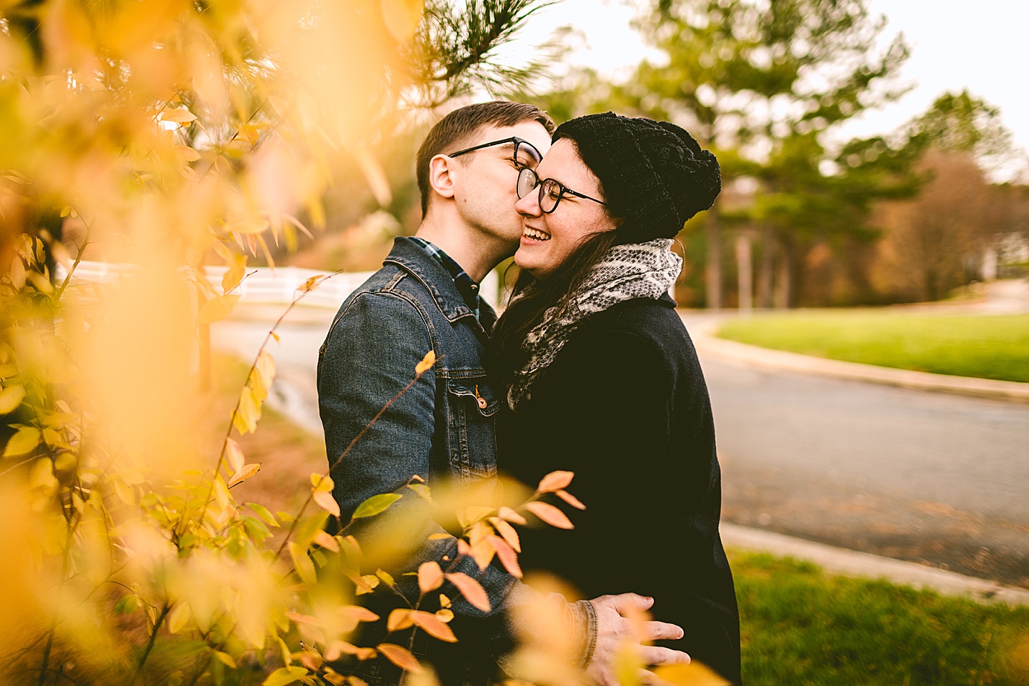 Couple posing for photographs outside in Raleigh