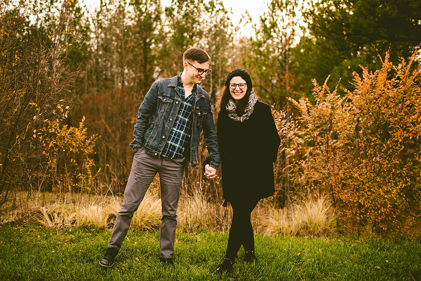 Couple posing for photographs outside in Raleigh