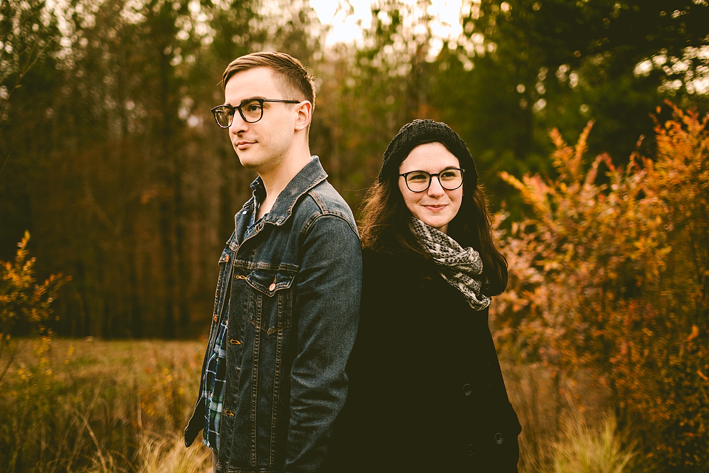 Couple posing for photographs outside in Raleigh