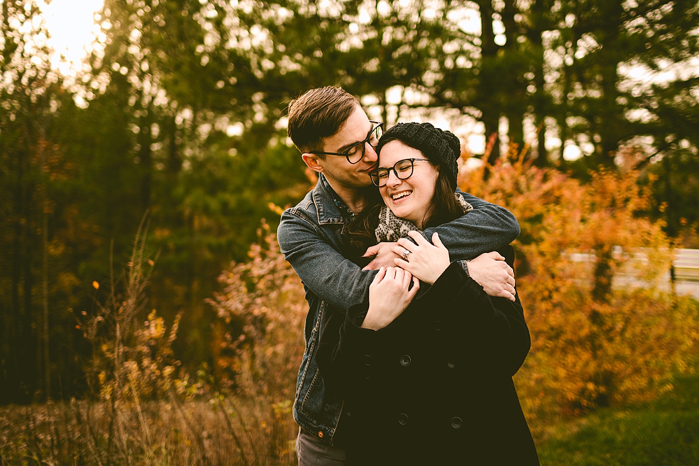 Couple posing for photographs outside in Raleigh