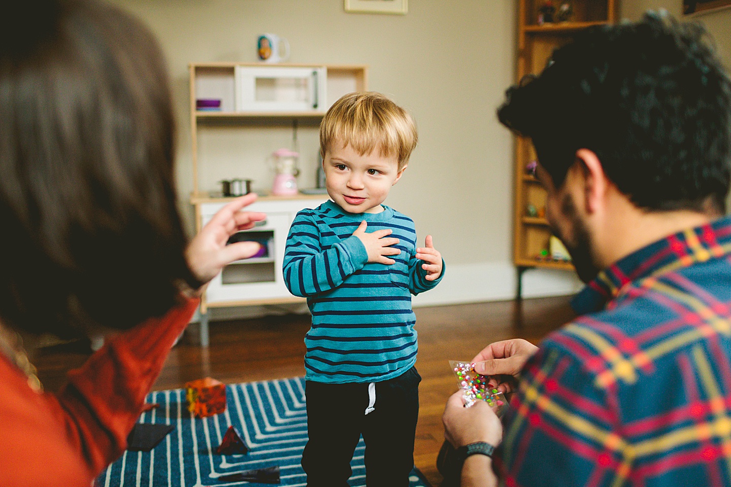 Kid putting stickers on shirt during photoshoot in Durham