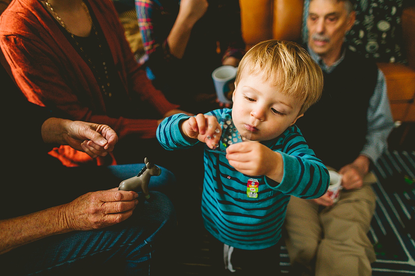 Kid playing with little gem stickers