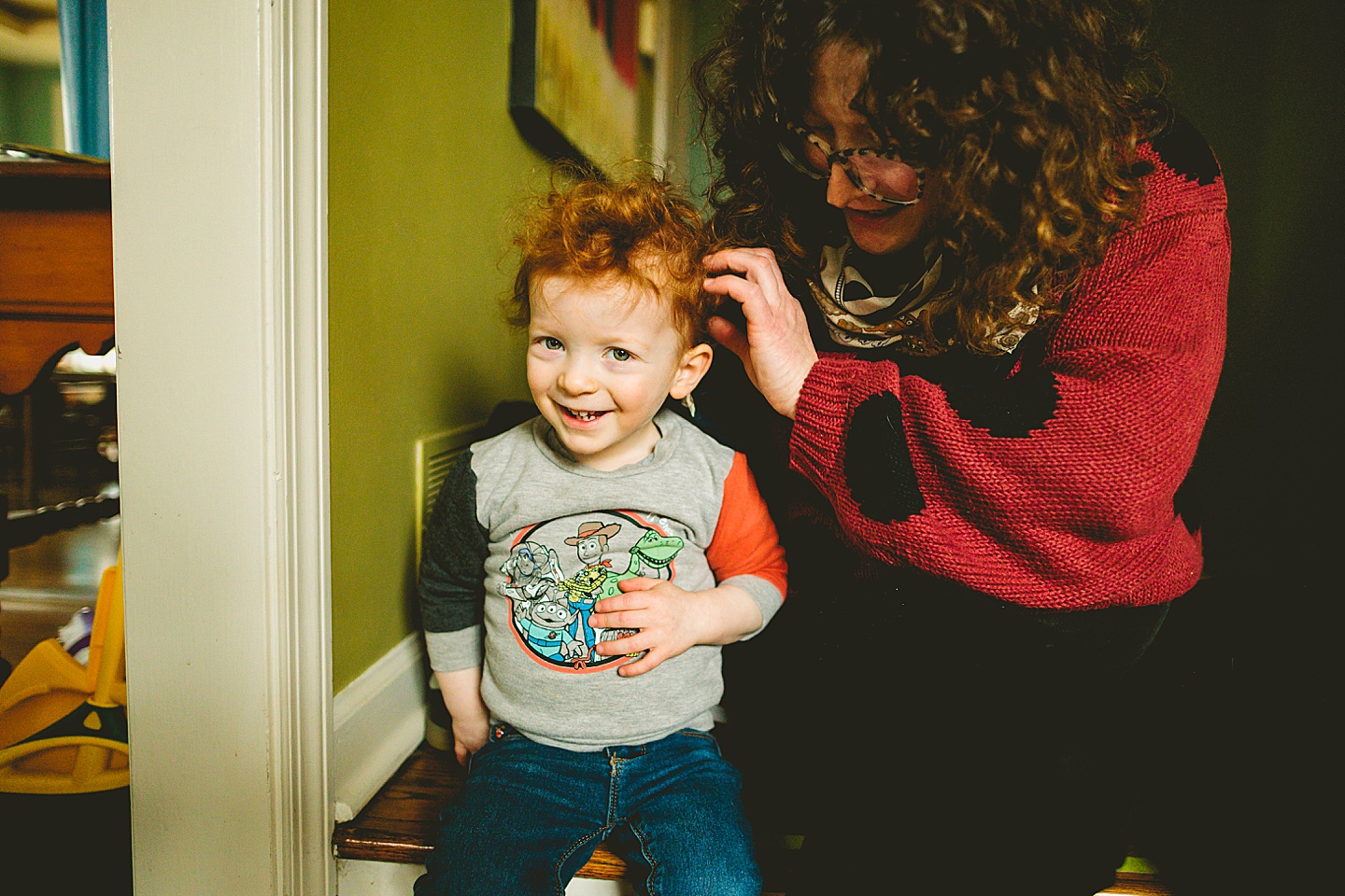 Mom playing with kid's hair