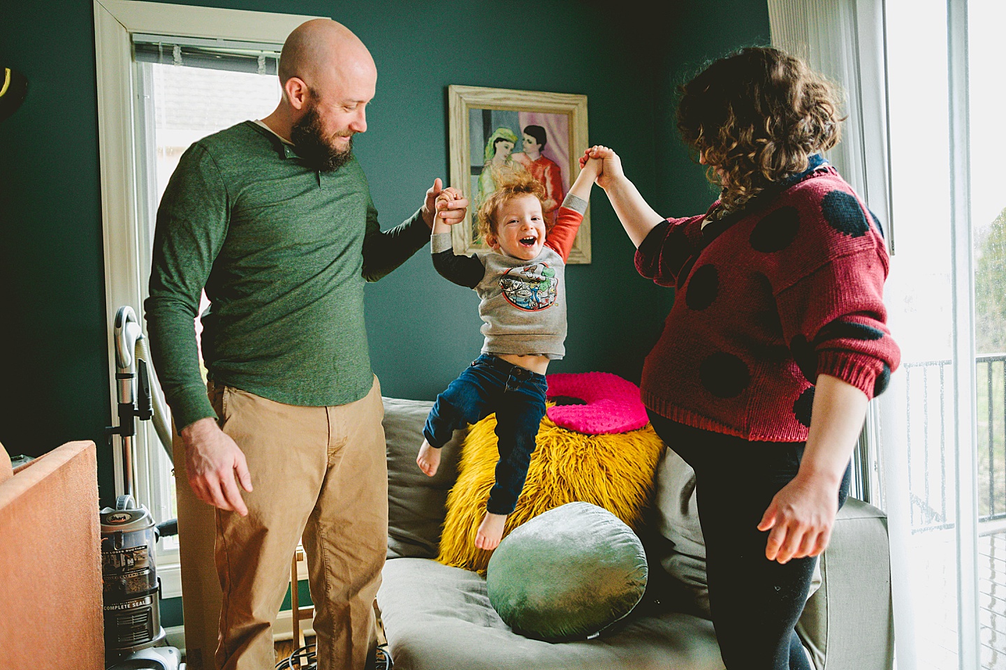 Toddler jumping on chair