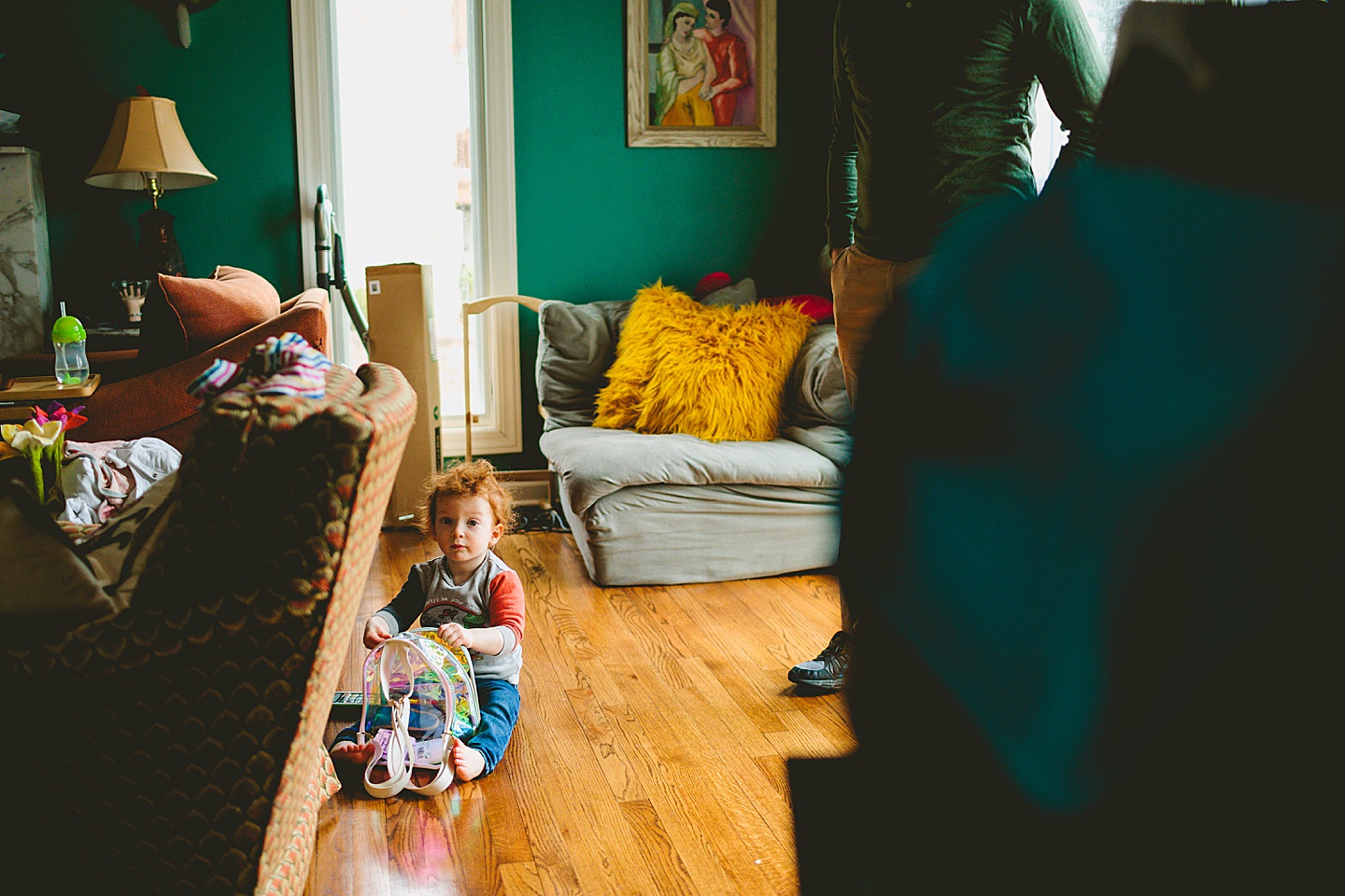 Toddler playing with bookbag