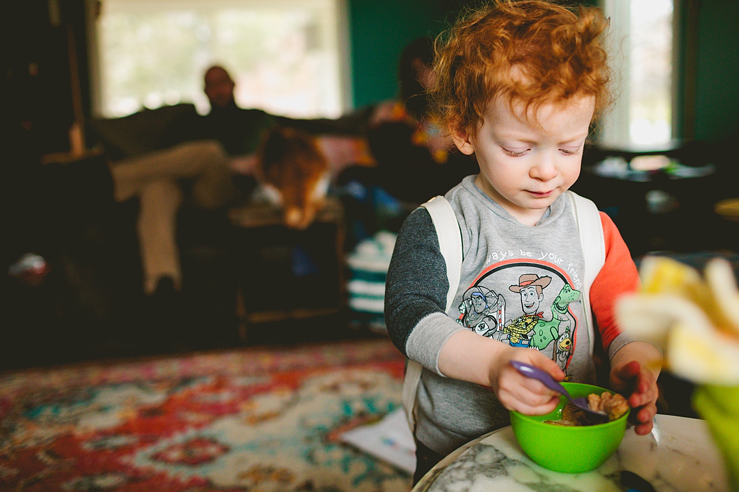 Toddler eating cereal