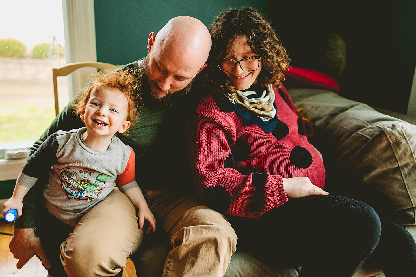 Family portrait with toddler and pregnant mom