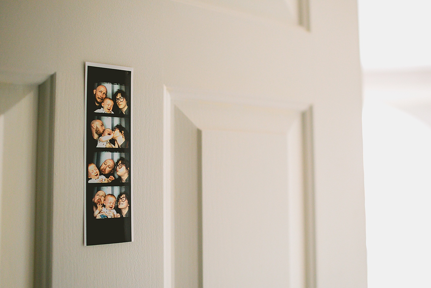 Photobooth pictures hung on door