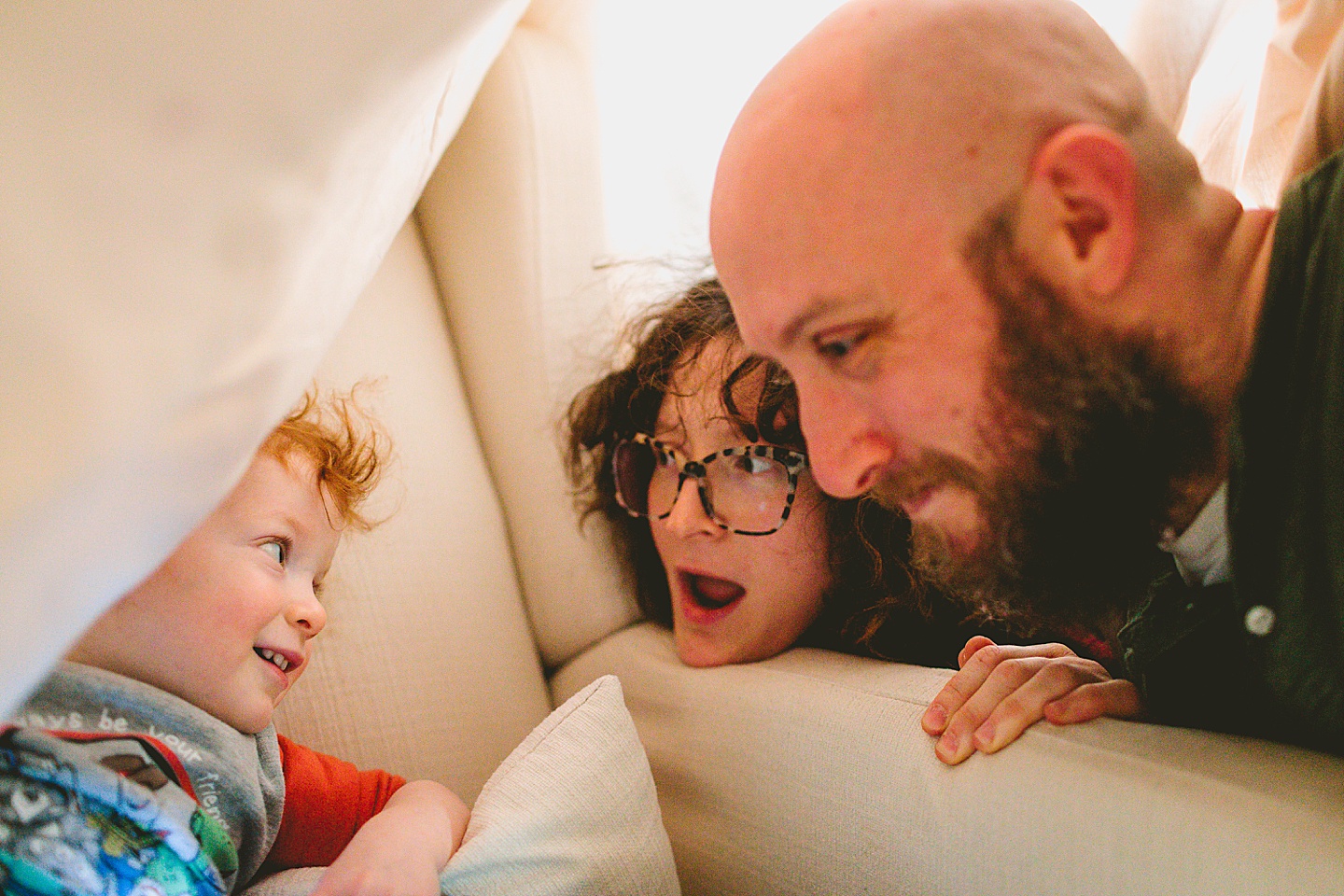 Kids and parents in blanket fort