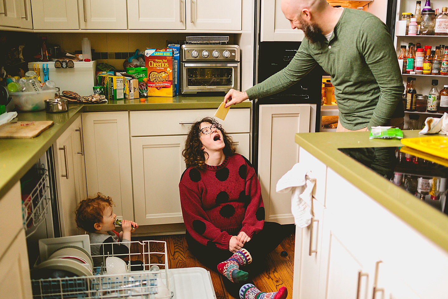 Dad getting pregnant wife cheese from the fridge