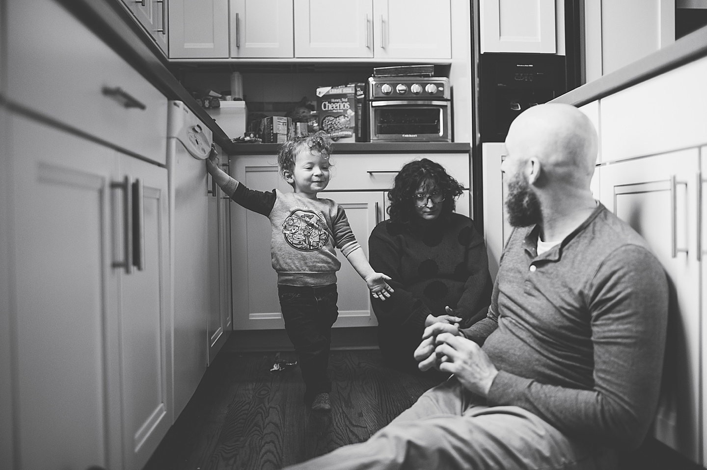 Toddler unloading dishwasher