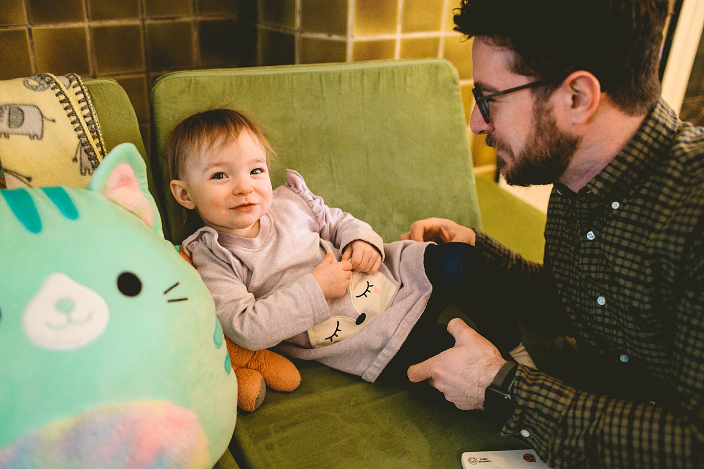 smiling toddler on couch