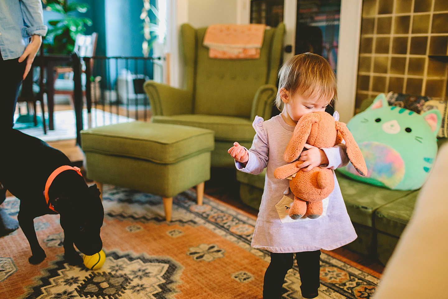 girl hugging baby bunny doll