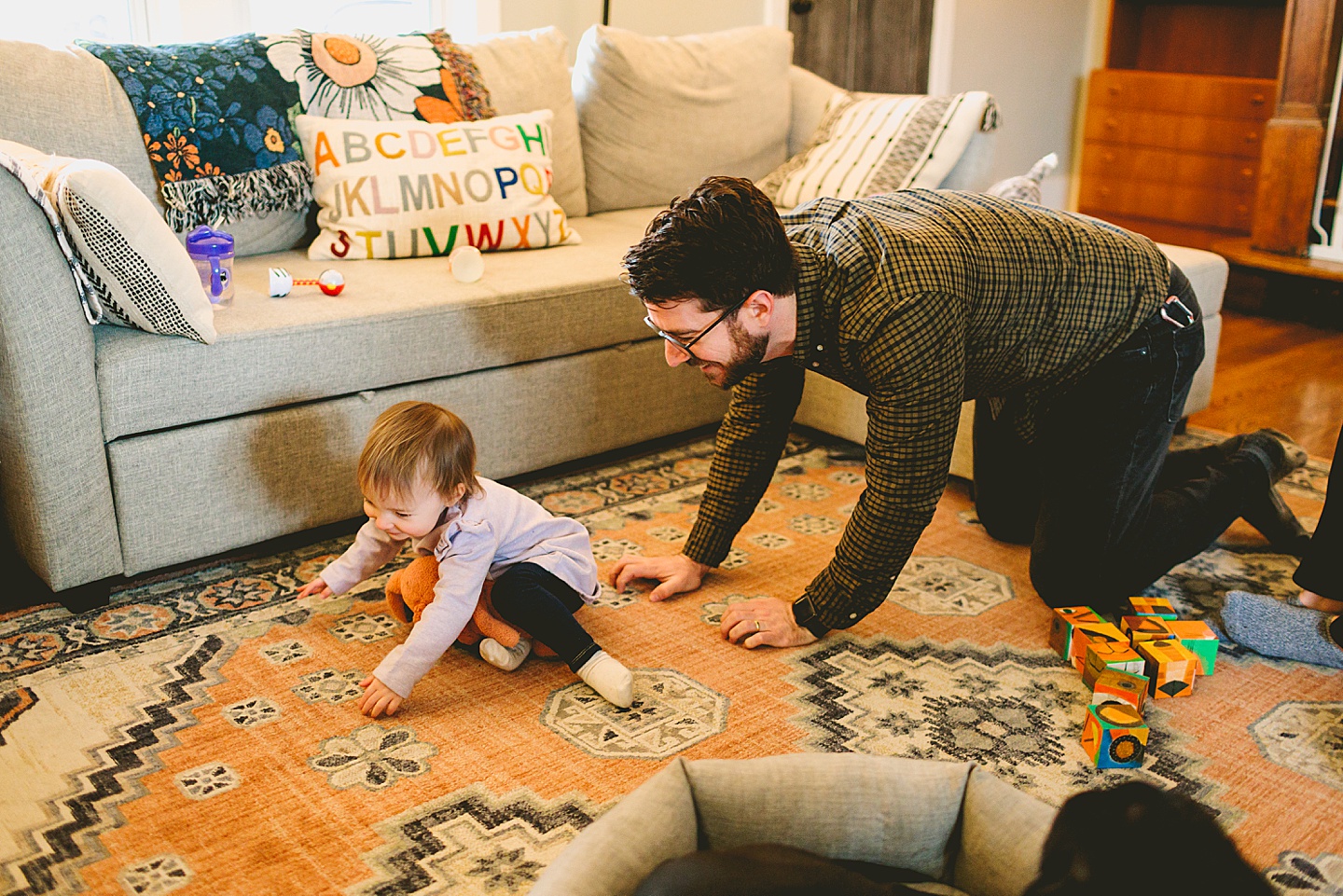 dad crawling after baby girl