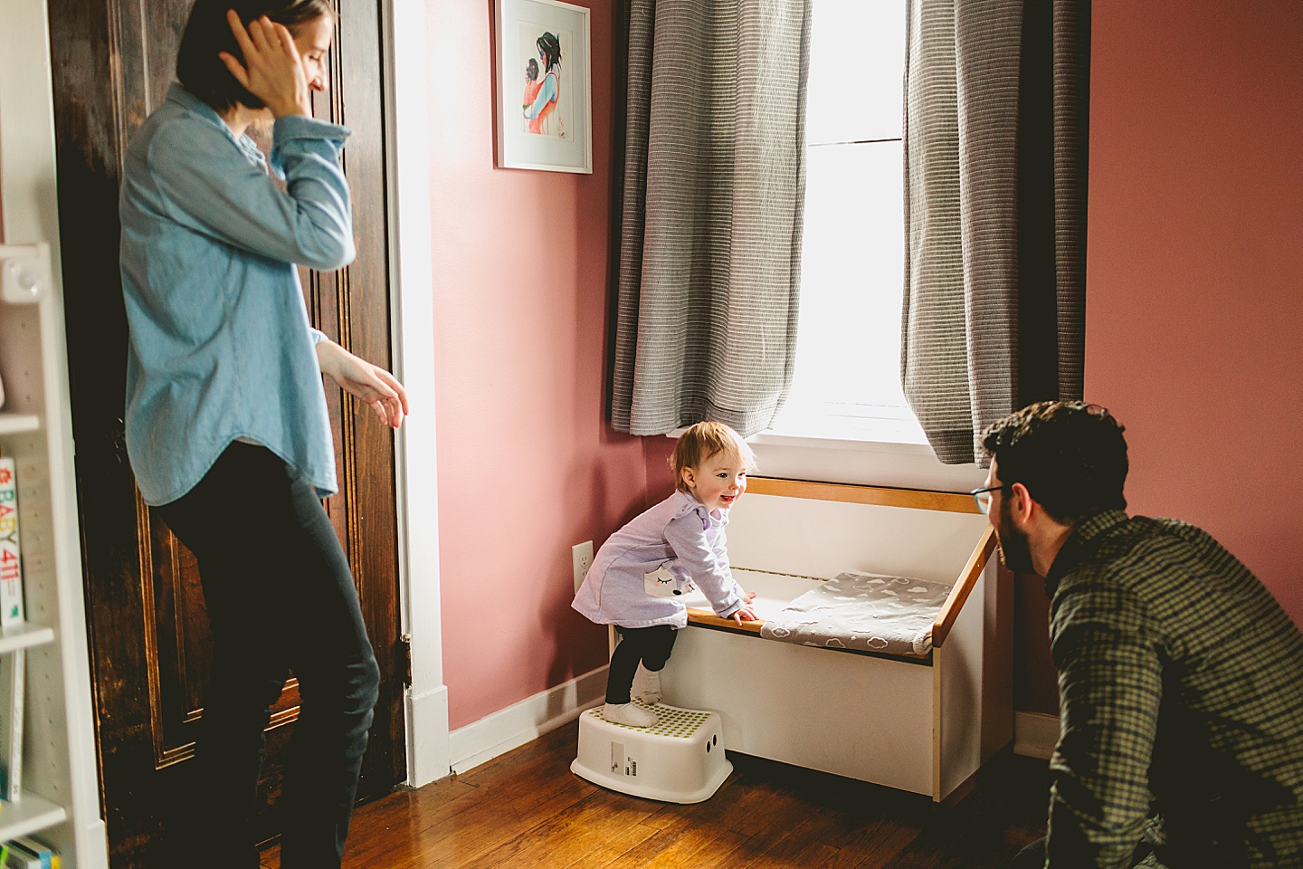 toddler climbing to look out window