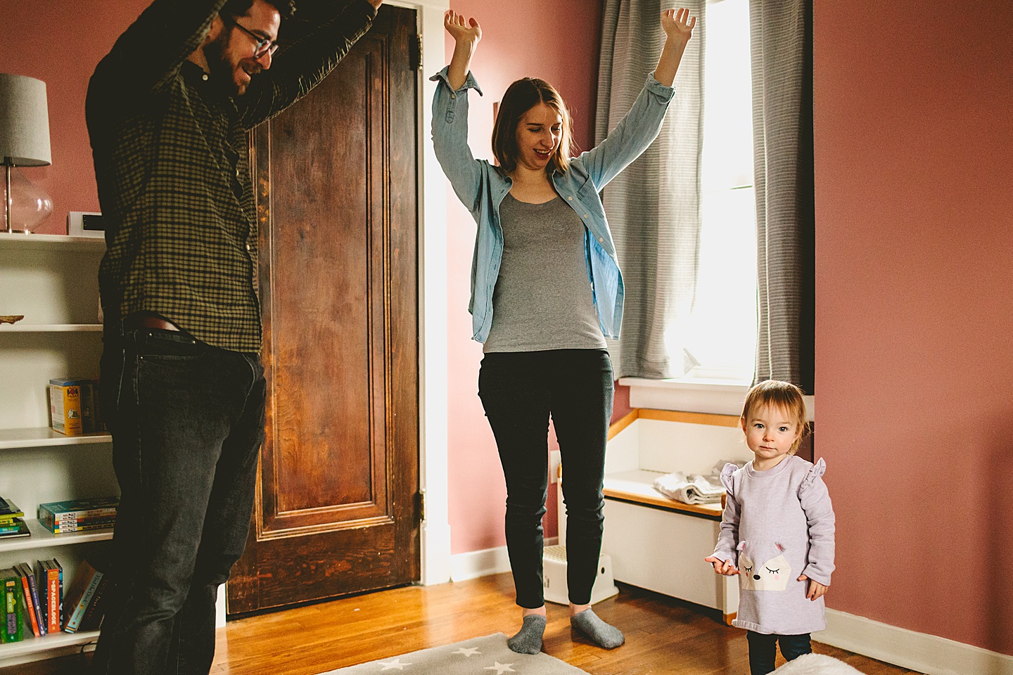 parents trying to get little girl to dance