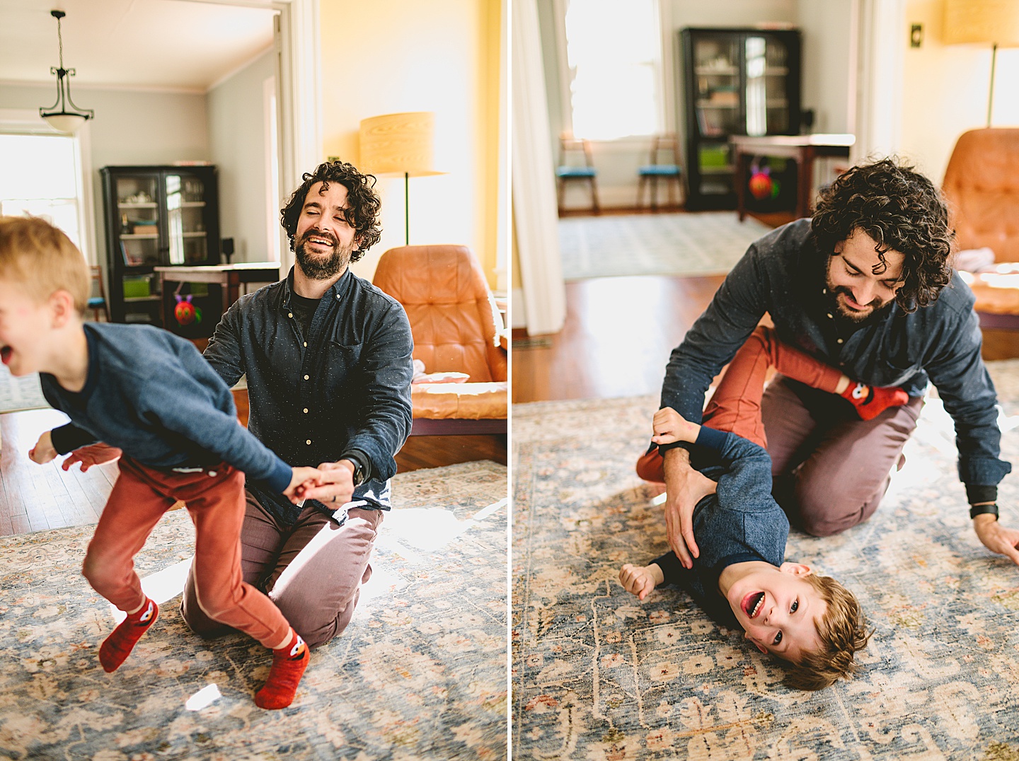Father and son wrestling on ground in living room laughing