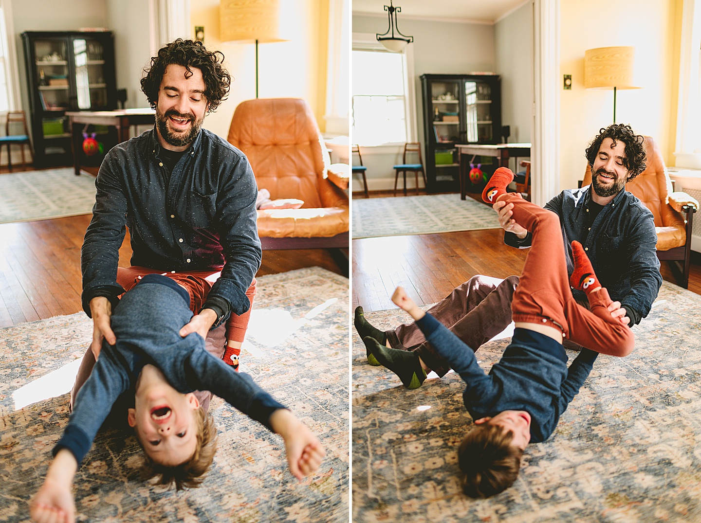 Father and son wrestling on ground in living room laughing