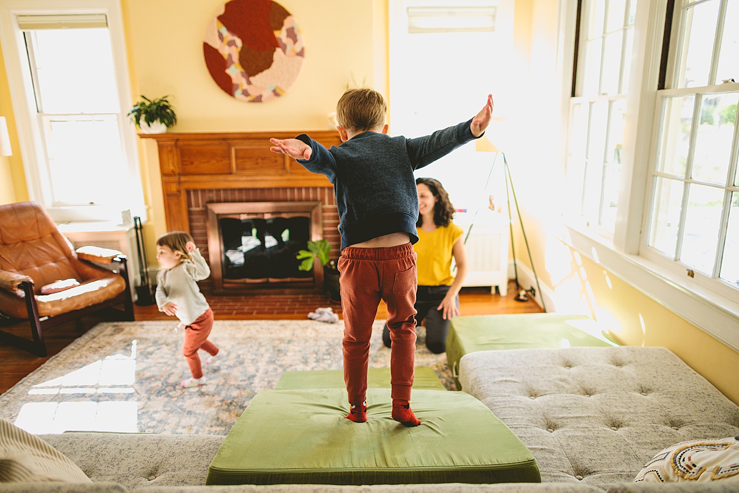 Kids having dance party in the living room during family pictures